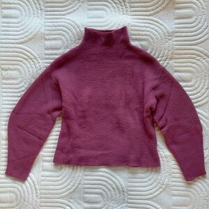 Bubblegum pink bubble-sleeved mock neck sweater